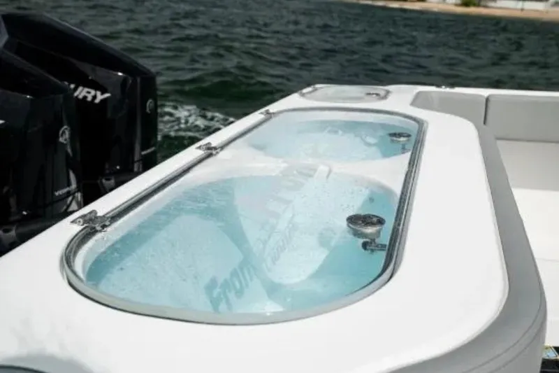 Slide: The Image of 2024 Front Runner 37 Catamaran with dual Mercury engines and livewell on deck. - 98