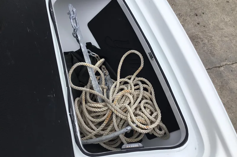Slide: The Image of Anchor and rope in storage compartment of 2020 Yellowfin 24 Bay CE boat. - 16