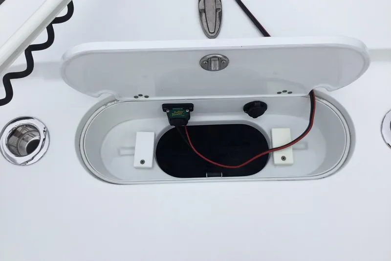 Slide: The Image of Open hatch on 2020 Yellowfin 24 Bay CE boat, showing wiring and components. - 17