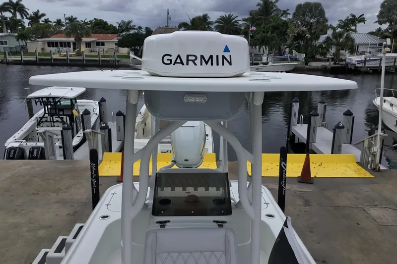 Slide: The Image of 2020 Yellowfin 24 Bay CE boat with Garmin equipment at a dockside marina. - 18