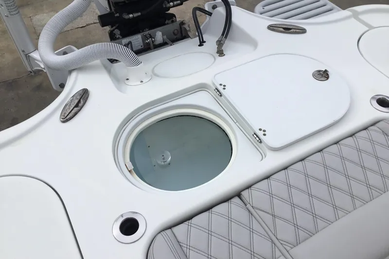 Slide: The Image of 2020 Yellowfin 24 Bay CE boat deck with storage compartments and seating. - 23