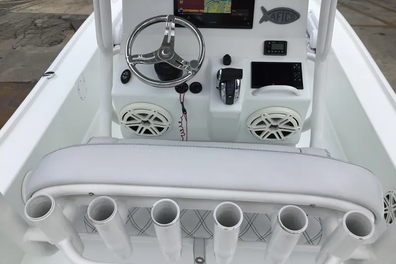 Slide: The Image of 2020 Yellowfin 24 Bay CE boat console with steering wheel, electronics, and rod holders. - 29