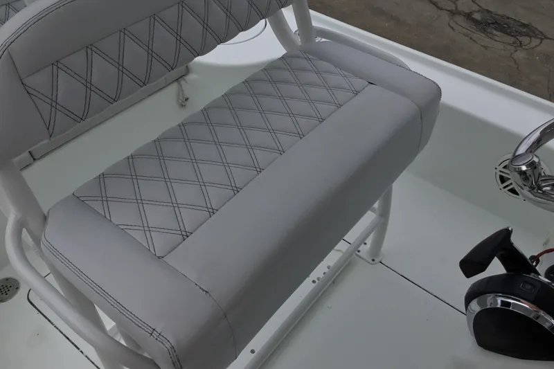 Slide: The Image of 2020 Yellowfin 24 Bay CE boat seat with diamond-stitched upholstery and control panel. - 32