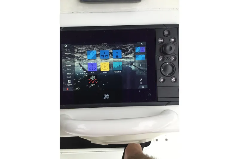Slide: The Image of 2020 Yellowfin 24 Bay CE boat dashboard with navigation and control display. - 35