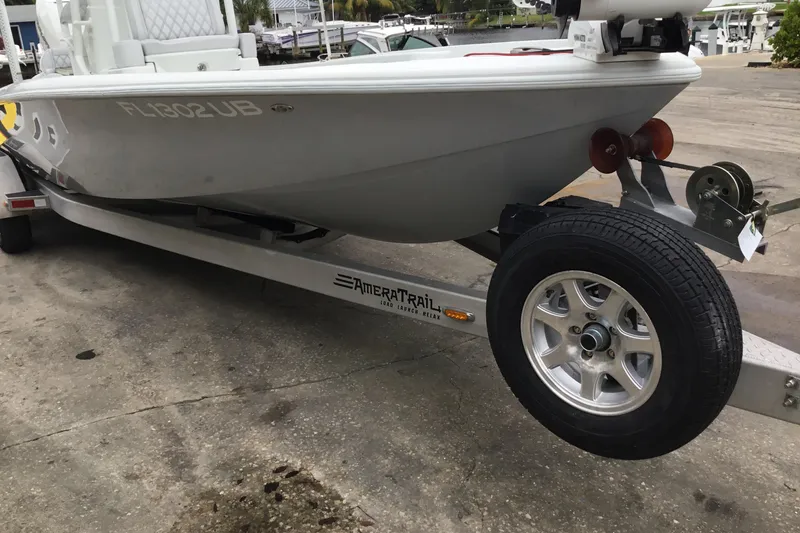 Slide: The Image of 2020 Yellowfin 24 Bay CE boat on trailer, parked on concrete surface. - 7