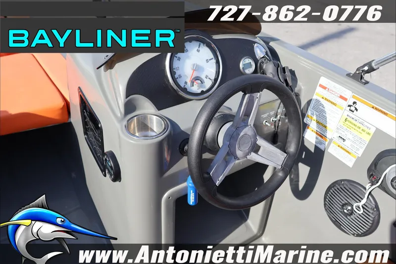 Slide: The Image of 2020 Bayliner Element E16 boat dashboard with steering wheel and gauges. - 13