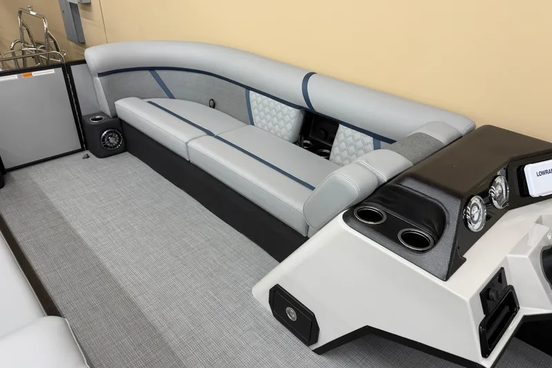 Slide: The Image of 2026 Crest Conquest 230 SLC boat interior with sleek seating and modern dashboard design. - 10