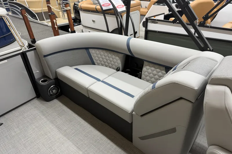 Slide: The Image of 2026 Crest Conquest 230 SLC boat interior with luxurious seating and modern design. - 11