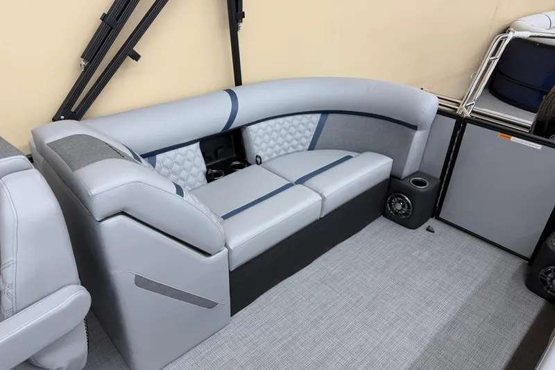 Slide: The Image of 2026 Crest Conquest 230 SLC boat interior with gray seating and cup holders. - 12