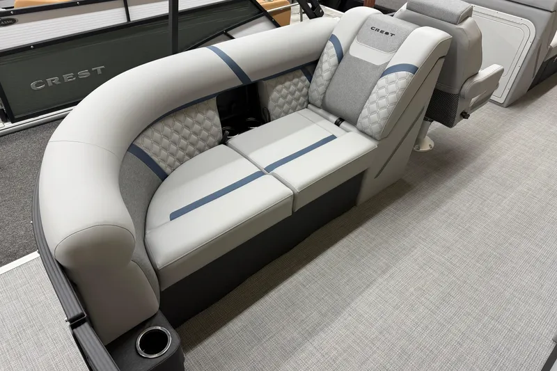 Slide: The Image of 2026 Crest Conquest 230 SLC boat interior with elegant seating and modern design. - 15