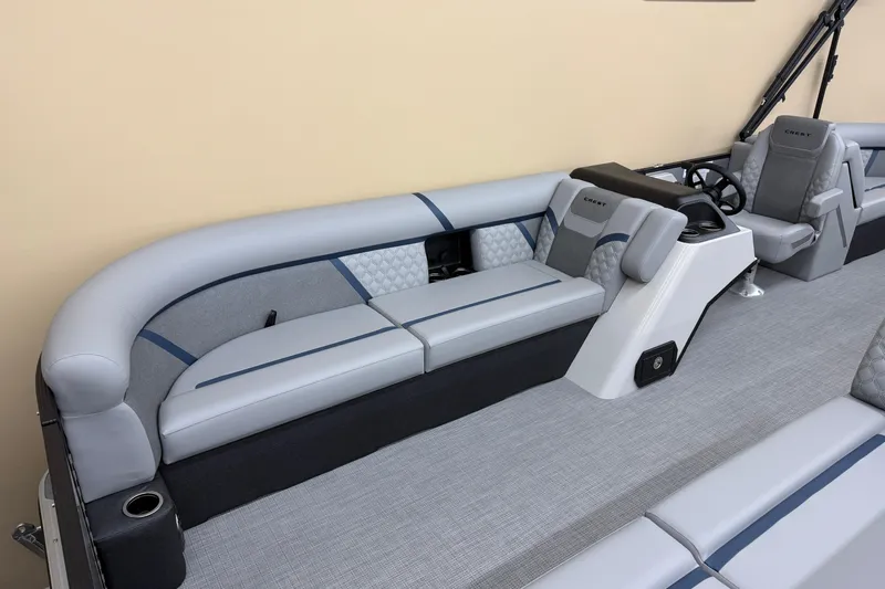 Slide: The Image of Luxurious interior of 2026 Crest Conquest 230 SLC pontoon boat with plush seating. - 4