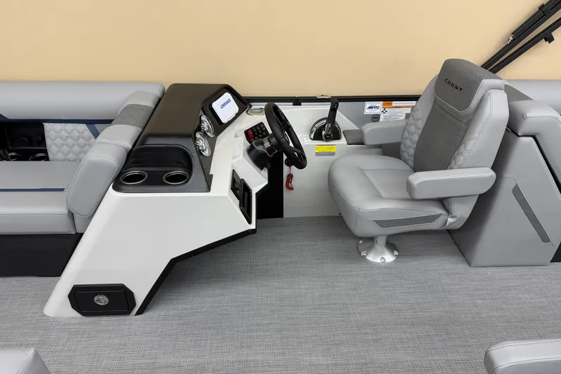 Slide: The Image of 2026 Crest Conquest 230 SLC boat interior with modern helm and comfortable seating. - 5