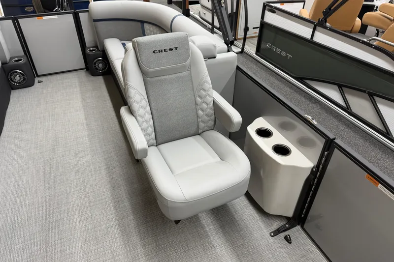 Slide: The Image of Luxurious seating on 2026 Crest Conquest 230 SLC pontoon boat interior. - 7