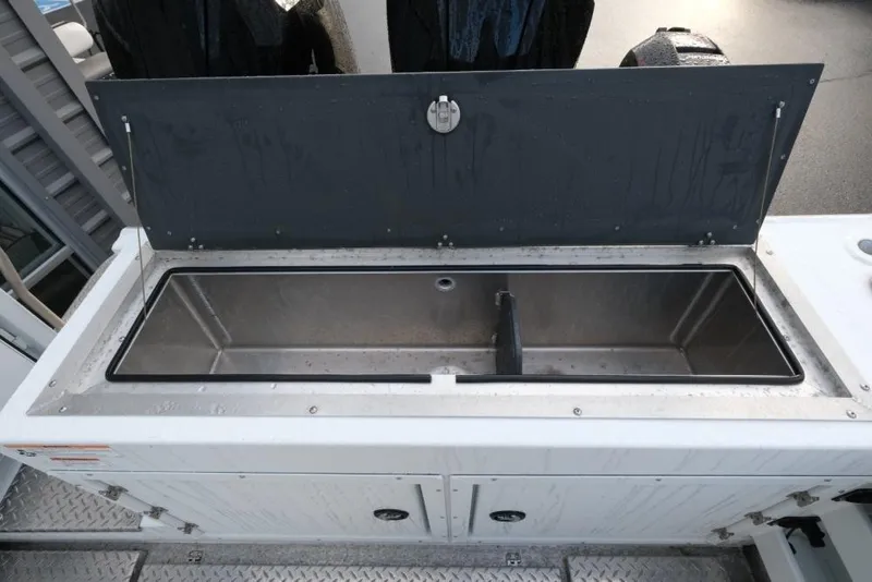 Slide: The Image of 2023 Hewescraft 270 Alaskan ET HT boat storage compartment with open lid. - 12