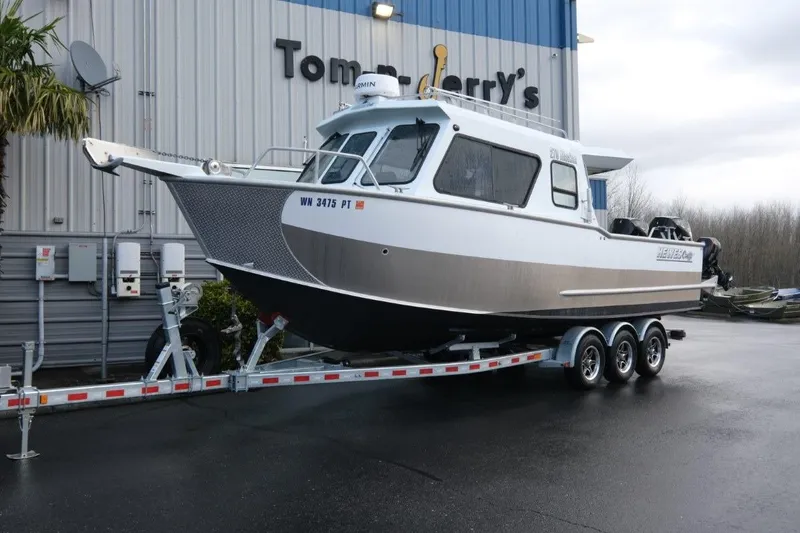 Slide: The Image of 2023 Hewescraft 270 Alaskan ET HT boat on trailer outside dealership. - 3