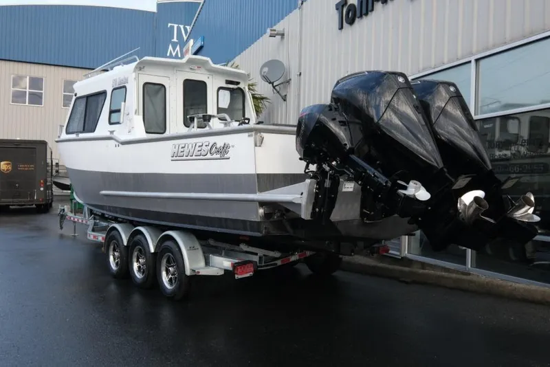 Slide: The Image of 2023 Hewescraft 270 Alaskan ET HT boat on trailer, dual outboard motors. - 6