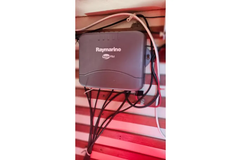 Slide: The Image of Raymarine SmartPilot device installed on 1984 Endeavour 33 sailboat with visible wiring. - 21