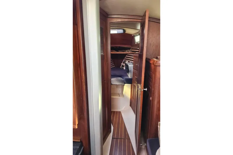 Slide: The Image of Interior view of 1984 Endeavour 33 sailboat cabin with wooden finish. - 23