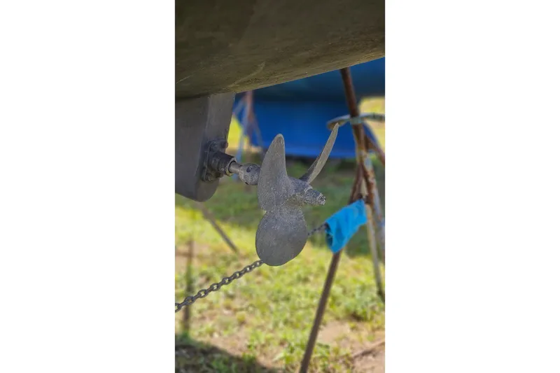 Slide: The Image of Propeller of 1984 Endeavour 33 sailboat on land, with blurred background. - 28