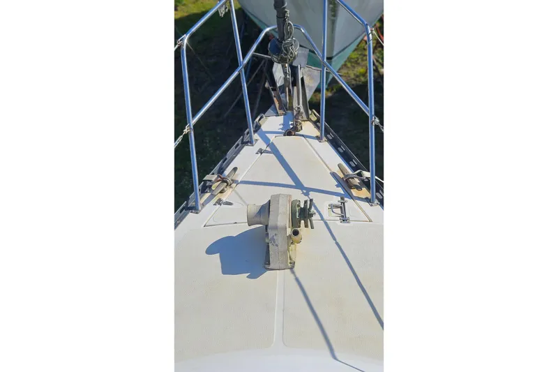 Slide: The Image of Bow of 1984 Endeavour 33 sailboat with anchor and railing. - 6