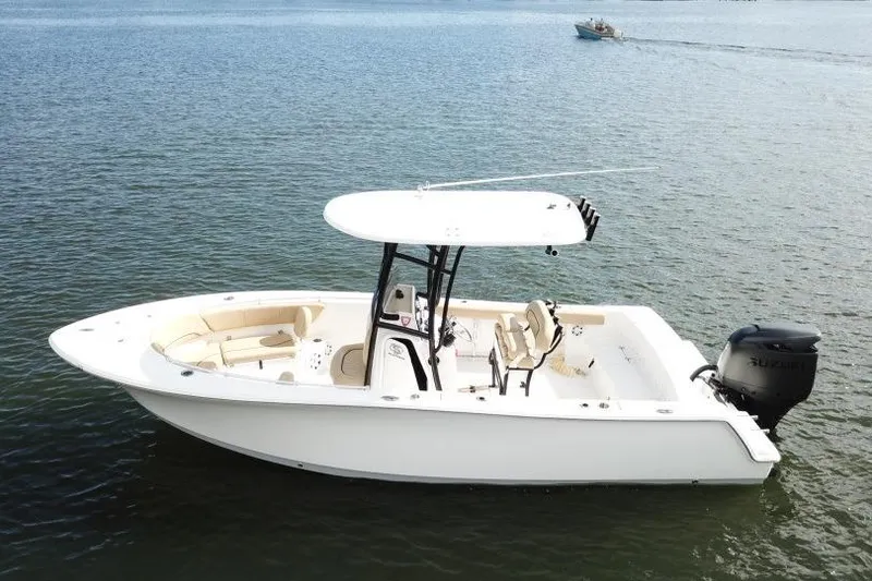 Slide: The Image of 2019 Sportsman Heritage 231 Center Console boat on calm water. - 4
