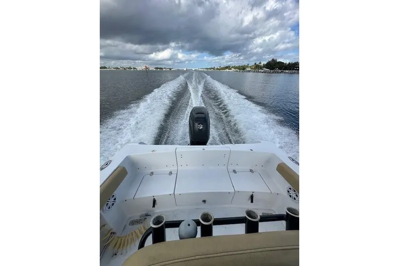 Slide: The Image of 2019 Sportsman Heritage 231 Center Console boat cruising on open water. - 8