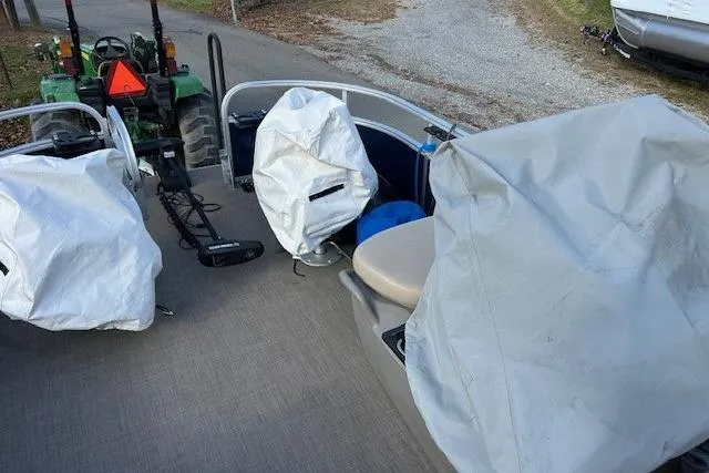 Slide: The Image of 2023 Sun Tracker Bass Buggy 16 XL Select pontoon boat with covered seats and equipment. - 13