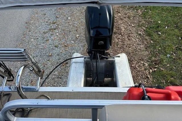 Slide: The Image of 2023 Sun Tracker Bass Buggy 16 XL Select pontoon boat with outboard motor. - 5