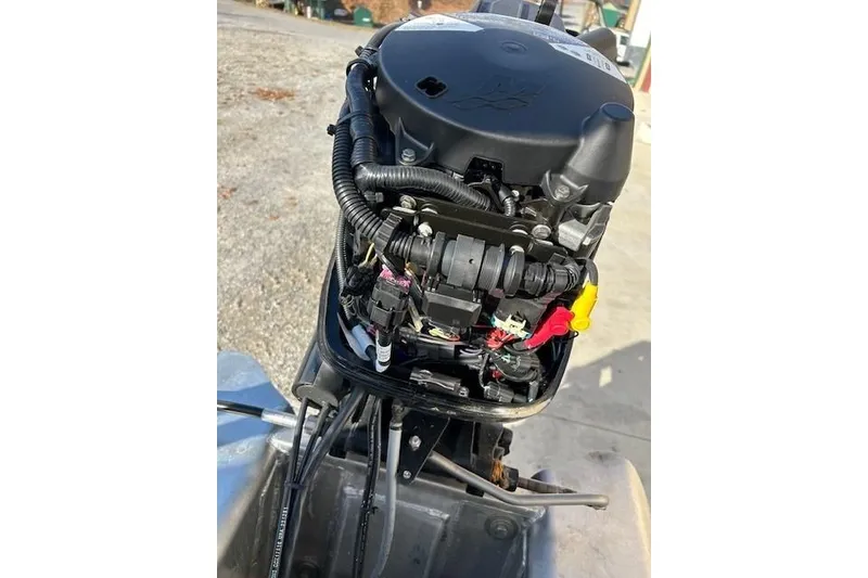 Slide: The Image of 2023 Sun Tracker Bass Buggy 16 XL Select outboard motor close-up. - 8