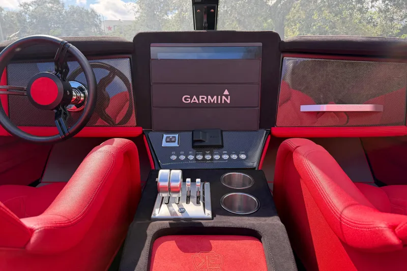 Slide: The Image of Red interior of 2022 Doug Wright 320 with Garmin navigation system and sleek controls. - 10