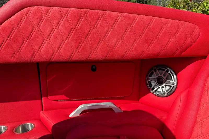 Slide: The Image of Red interior of 2022 Doug Wright 320 boat with speaker and quilted upholstery. - 13