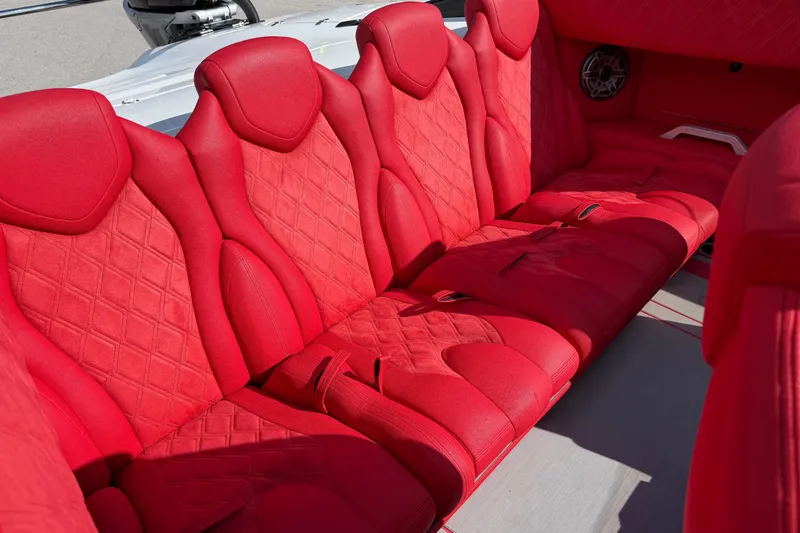 Slide: The Image of Luxurious red seating in a 2022 Doug Wright 320 boat, featuring diamond stitching. - 15