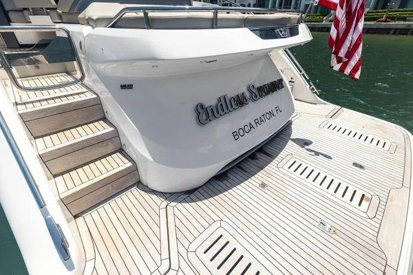 Slide: The Image of 2020 Princess V55 yacht with teak deck, named "Endless Summer," docked in Boca Raton, FL. - 10