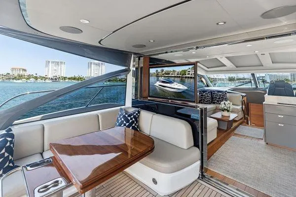 Slide: The Image of Luxurious 2020 Princess V55 yacht interior with elegant seating and scenic ocean view. - 17
