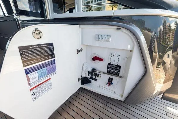 Slide: The Image of 2020 Princess V55 yacht control panel with open compartment on deck. - 19