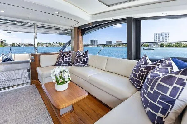 Slide: The Image of Luxurious 2020 Princess V55 yacht interior with elegant seating and scenic ocean views. - 20