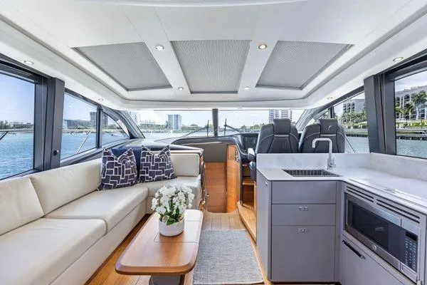 Slide: The Image of Luxurious interior of 2020 Princess V55 yacht with modern seating and kitchenette. - 22