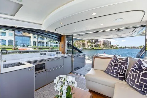 Slide: The Image of Luxurious 2020 Princess V55 yacht interior with modern kitchen and waterfront view. - 24