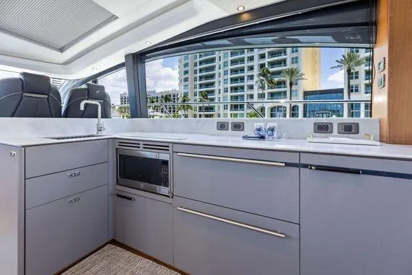 Slide: The Image of Modern kitchen interior on 2020 Princess V55 yacht with sleek cabinetry and appliances. - 25