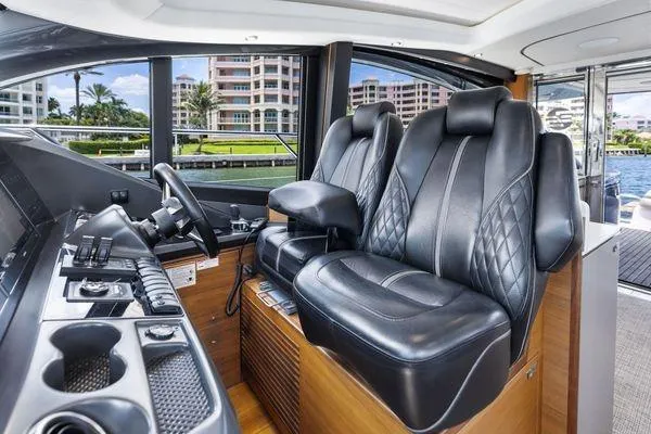 Slide: The Image of Luxurious 2020 Princess V55 yacht interior with leather seats and modern controls. - 28