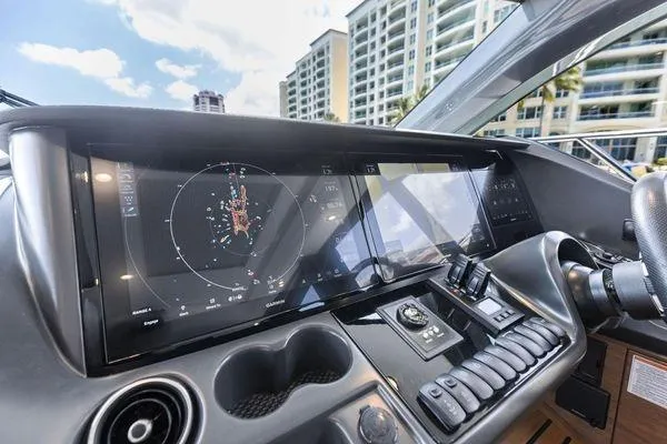 Slide: The Image of Helm of 2020 Princess V55 yacht with advanced navigation displays and controls. - 29