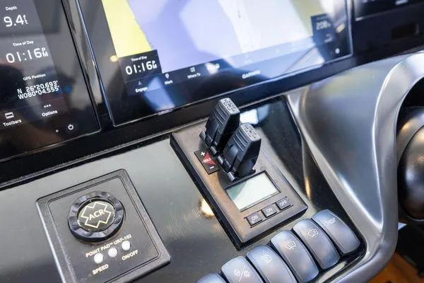 Slide: The Image of Control panel of a 2020 Princess V55 yacht with navigation and control switches. - 30