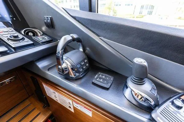 Slide: The Image of Control panel of a 2020 Princess V55 yacht, featuring advanced navigation equipment. - 32