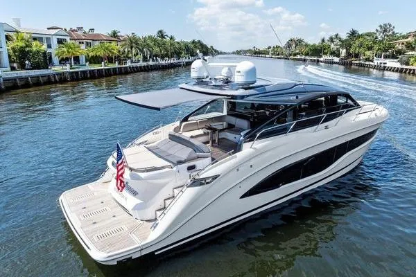 Slide: The Image of Luxurious 2020 Princess V55 yacht cruising on a scenic waterway. - 4