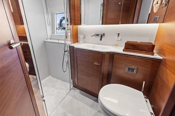Slide: The Image of Luxurious bathroom in 2020 Princess V55 yacht with modern fixtures and wooden cabinetry. - 42