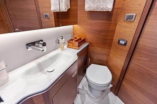 Slide: The Image of Luxurious bathroom in 2020 Princess V55 yacht with modern fixtures and wooden accents. - 43