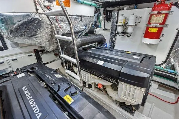 Slide: The Image of Engine room of 2020 Princess V55 yacht with Volvo Penta engines and safety equipment. - 46
