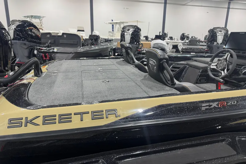 Slide: The Image of 2026 Skeeter FXR20 Apex boat interior with steering wheel and seating. - 15