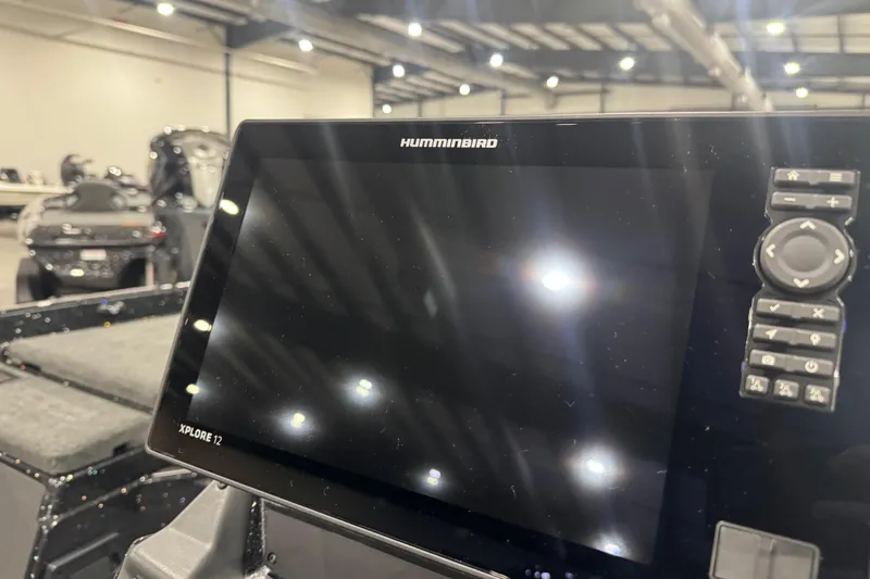 Slide: The Image of Humminbird Xplore 12 display on 2026 Skeeter FXR20 Apex boat, indoor showroom. - 17