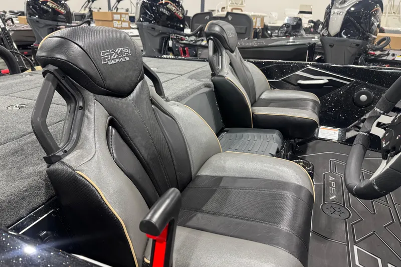 Slide: The Image of 2026 Skeeter FXR20 Apex boat interior with premium seating and steering wheel. - 18